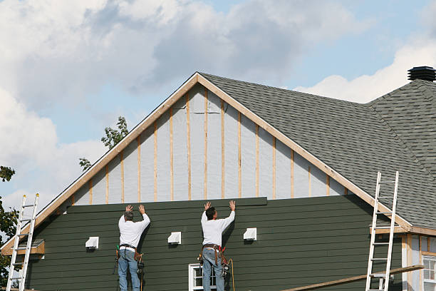 Professional Storm Damage Siding Repair technician working in Westwood, KY